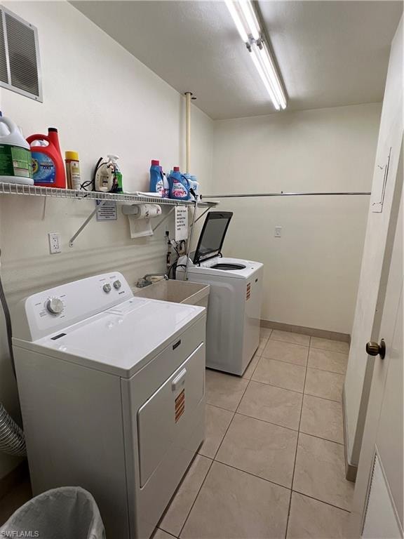 Dedicated shared free laundry room featuring tile flooring. Each floor has their own room. Just bring your laundry detergent and supplies