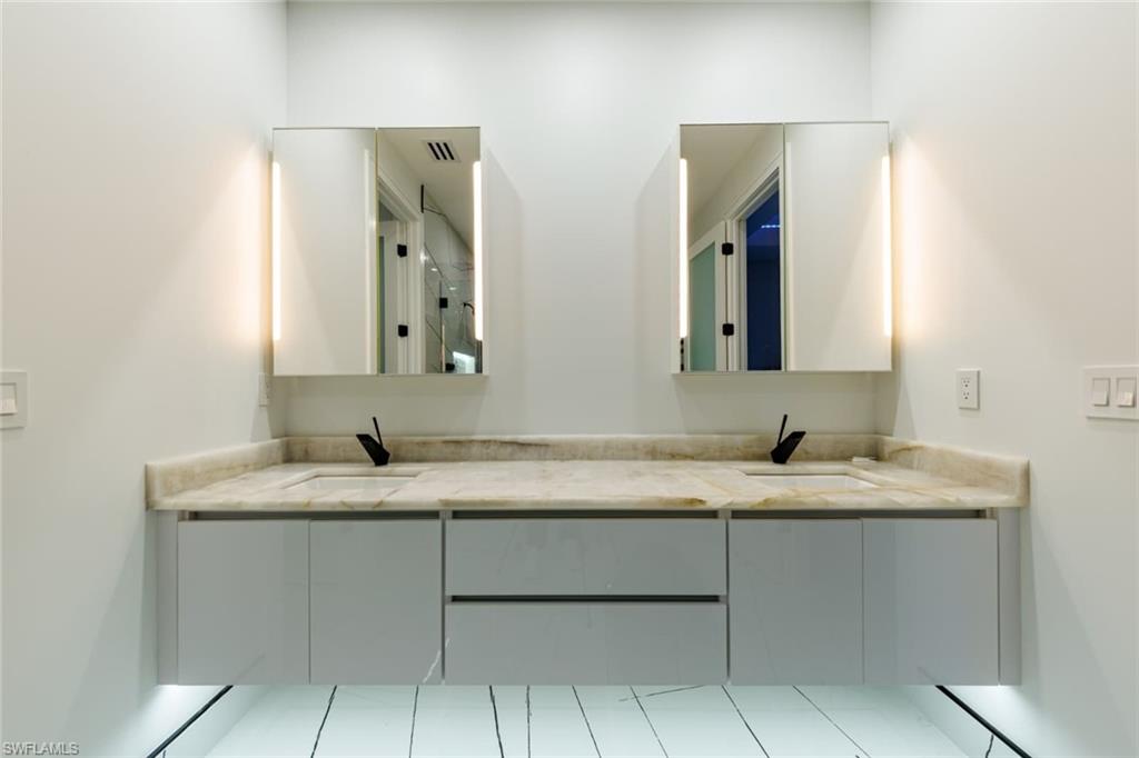 Full bath featuring double vanity