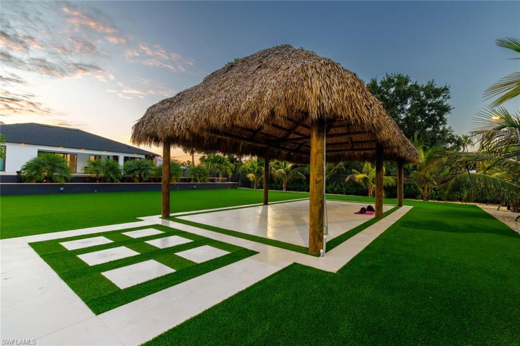 View of community with a lawn, a patio, and a gazebo