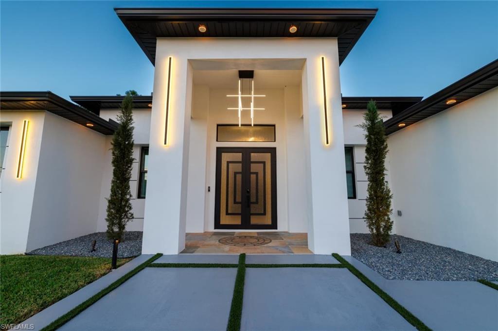 Property entrance with stucco siding