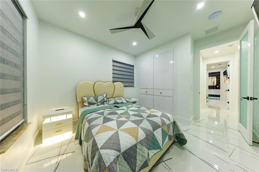 Bedroom with recessed lighting, a ceiling fan, and a closet