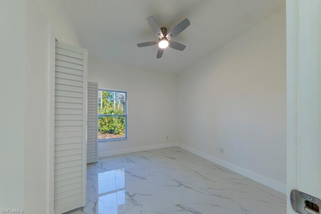 Bright interior space featuring white walls and white baseboards