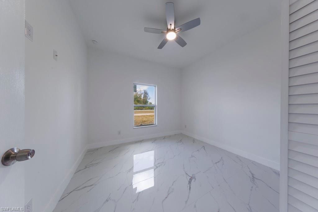 Bright interior space featuring white walls and white trim