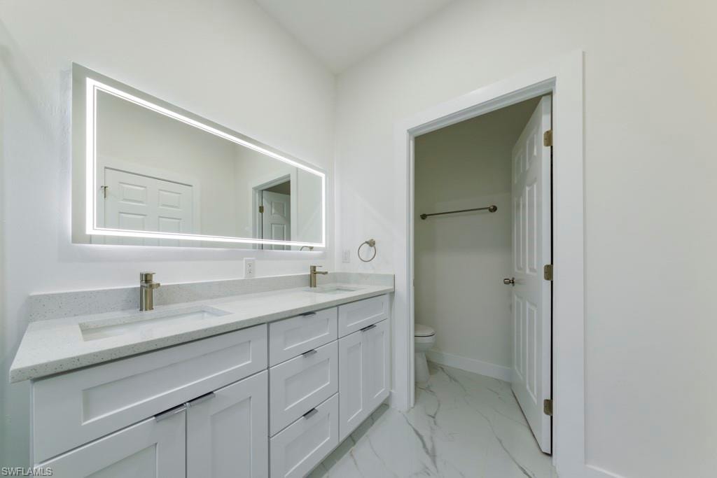 Dual vanity with quartz countertop, undermount sinks, and brushed nickel fixtures