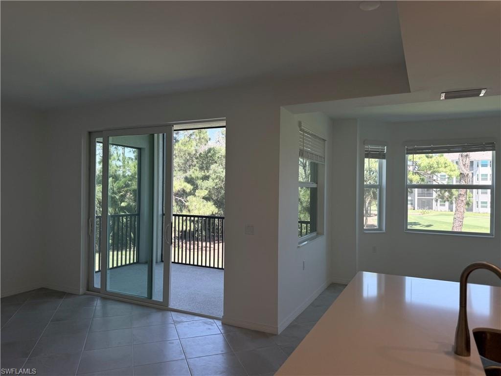 View of open space between living room, kitchen and dining room leading to the lanai.