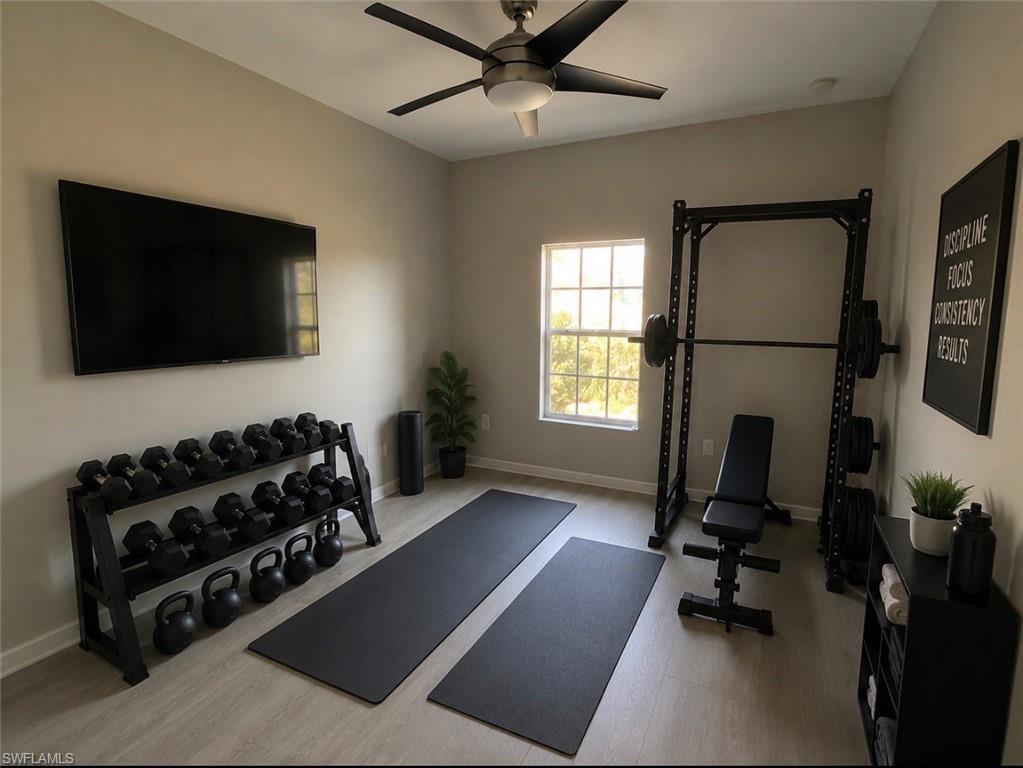 Versatile bonus room featuring light wood-finish flooring, a contemporary ceiling fan, and a double-pane window