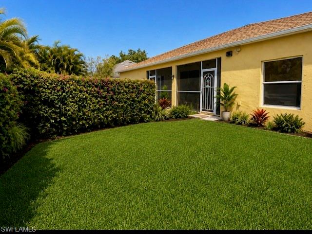 Expansive green lawn with mature hedge landscaping