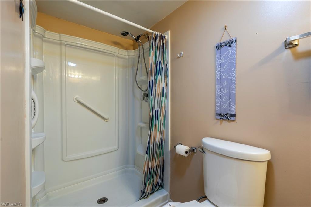 Ensuite Bathroom featuring walk-in shower stall