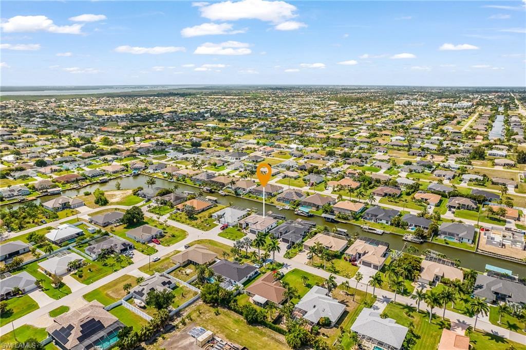Aerial perspective showcasing a residential community with numerous properties