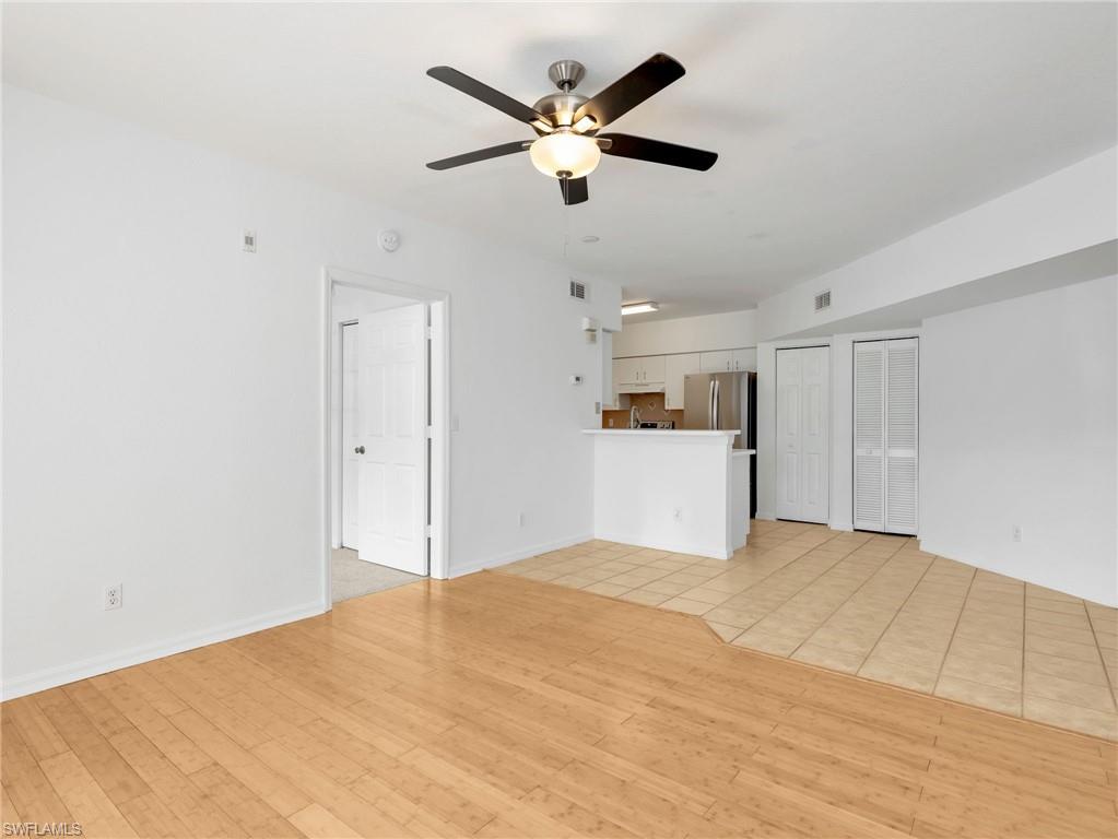 Kitchen with Tile Flooring, White Cabinetry, Stainless Steel Appliances, Tile Backsplash & Pantry - Door To Primary