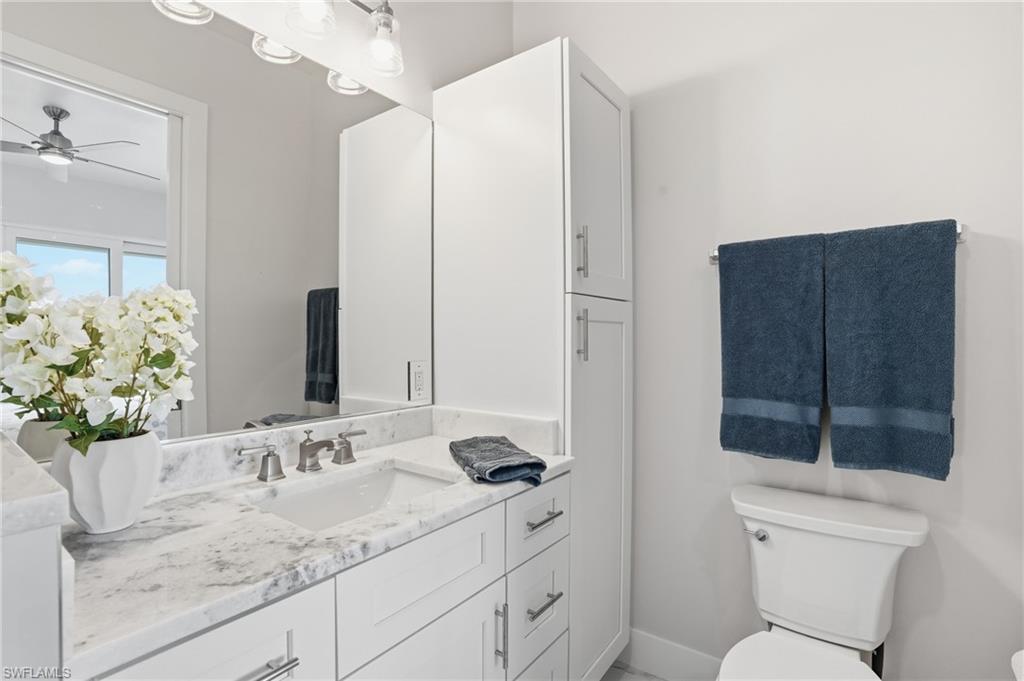 Bathroom featuring vanity and toilet - Virtually Edited Image