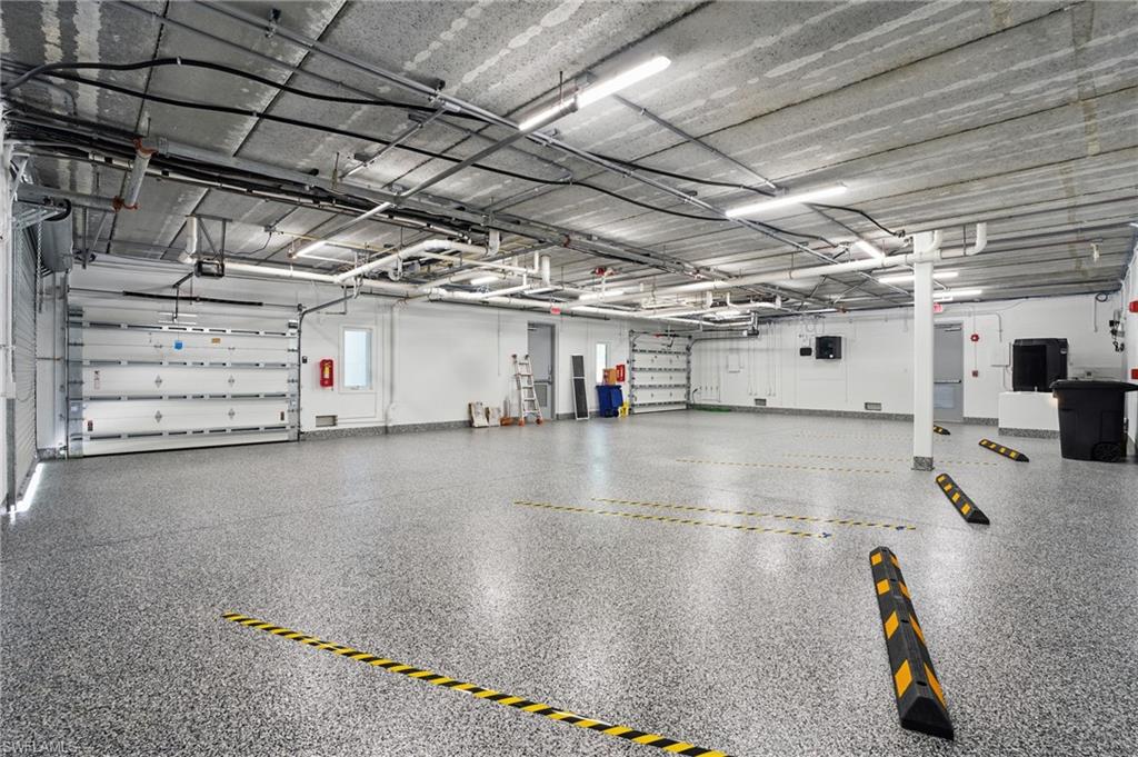 BEAUTIFUL EPOXY FLOOR + ENCLOSED GARAGE PARKING SPACES - VIRTUALLY EDITED