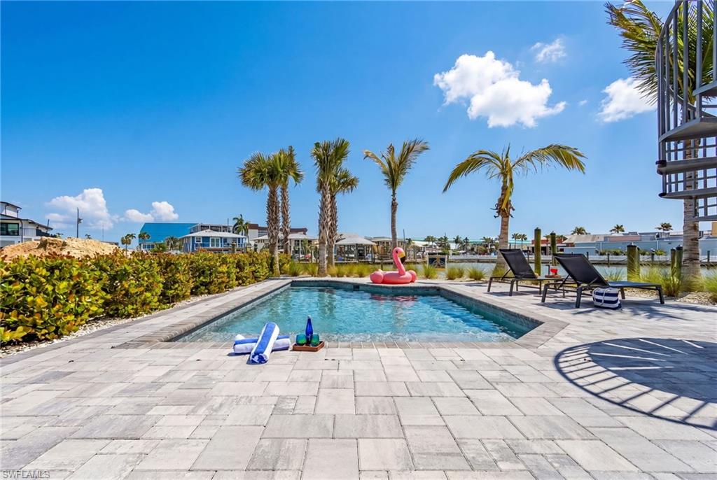 Private swimming pool surrounded by a paver patio - Virtually Edited Image