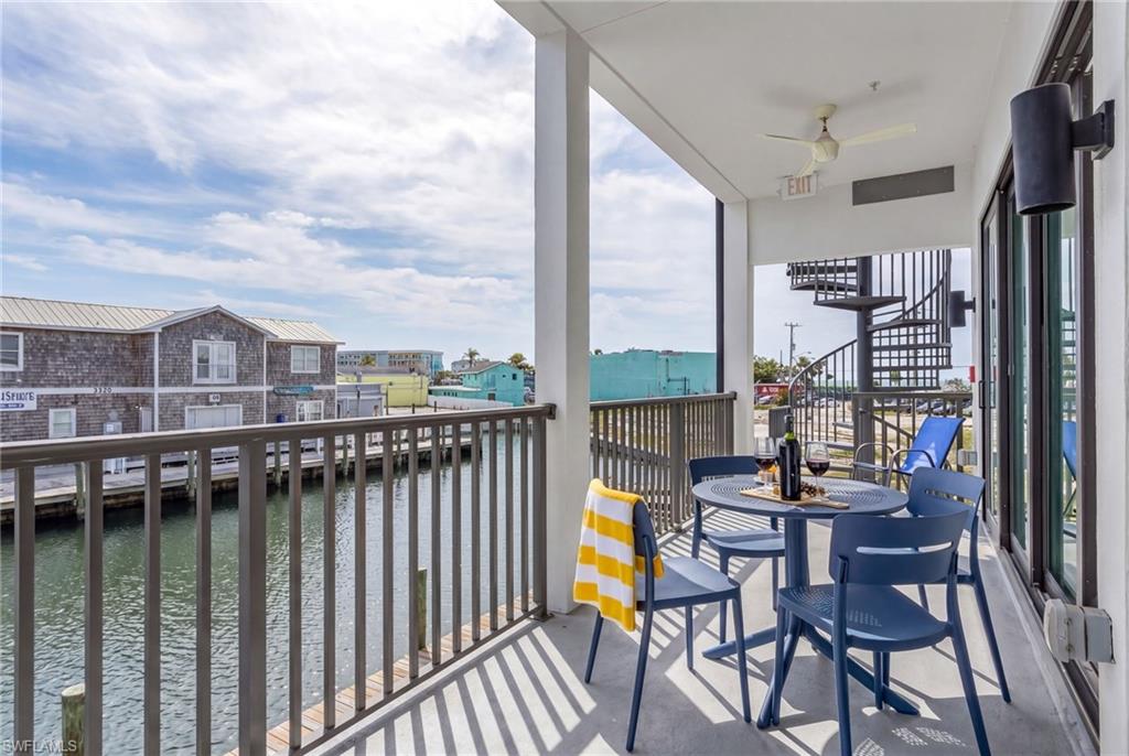 Covered balcony with water frontage and a metal railing - Virtually Edited Image