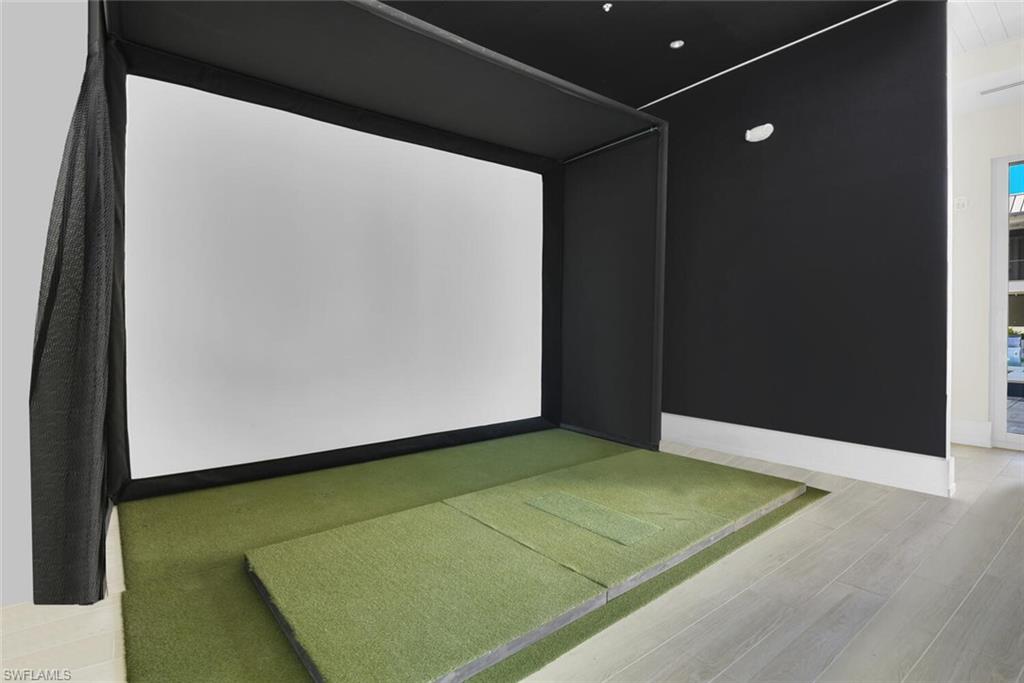Home theater featuring golf simulator