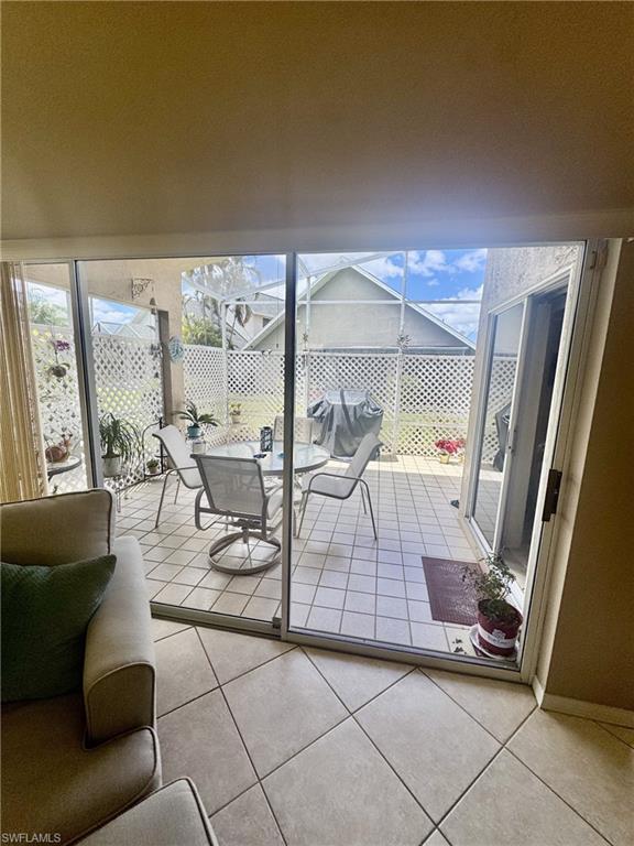 Triple sliders to screened lanai from great room