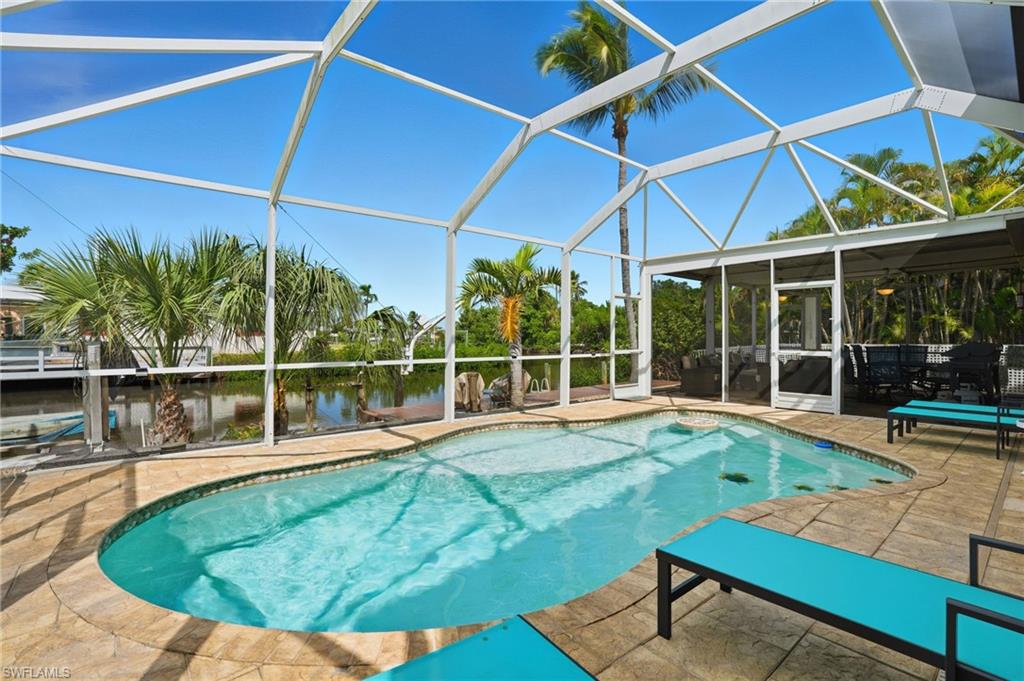 Swimming pool with plenty of outdoor space and screen enclosure- Virtually Edited Image