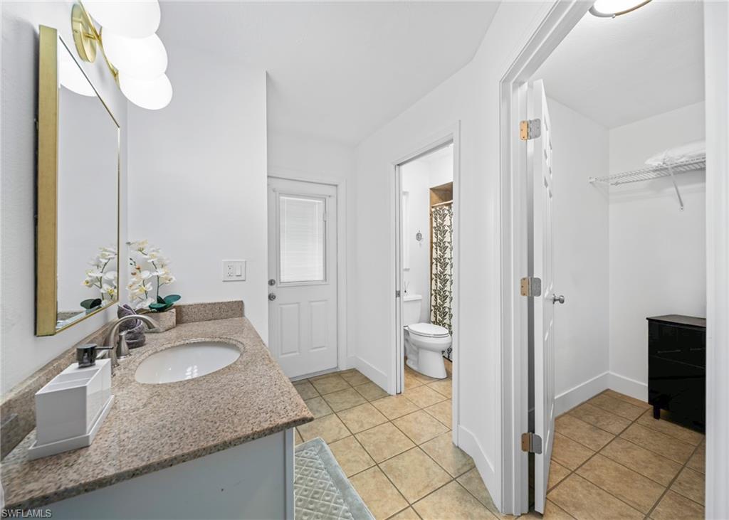 Bathroom vanity with a granite countertop and an undermount sink
