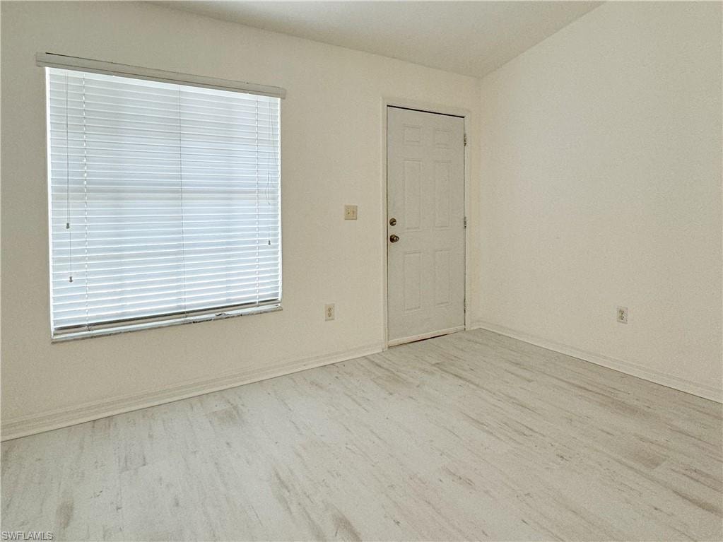 Spare room featuring light hardwood / wood-style flooring