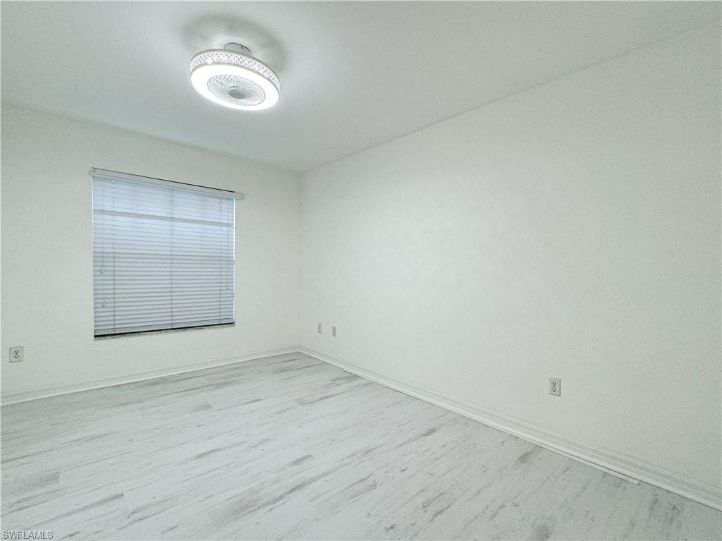Spare room featuring light wood-type flooring