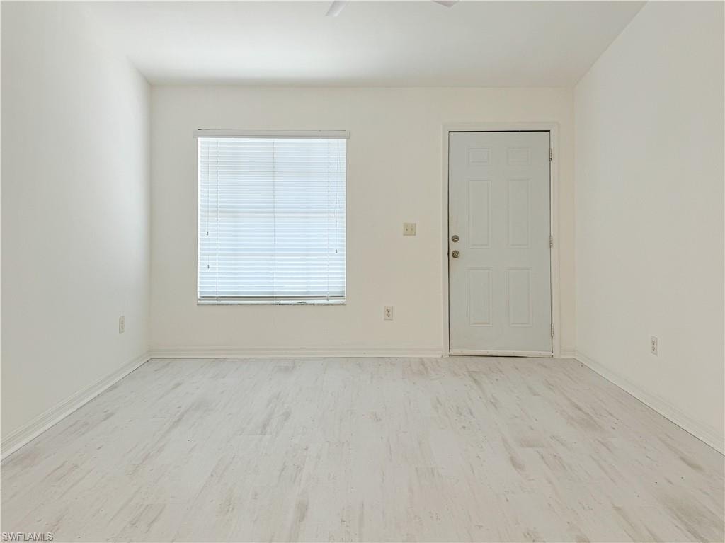 Unfurnished room featuring light wood-type flooring
