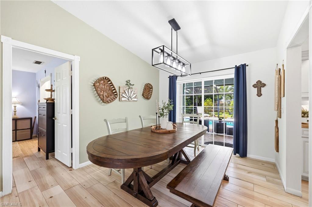 Dining area w view of patio and pool