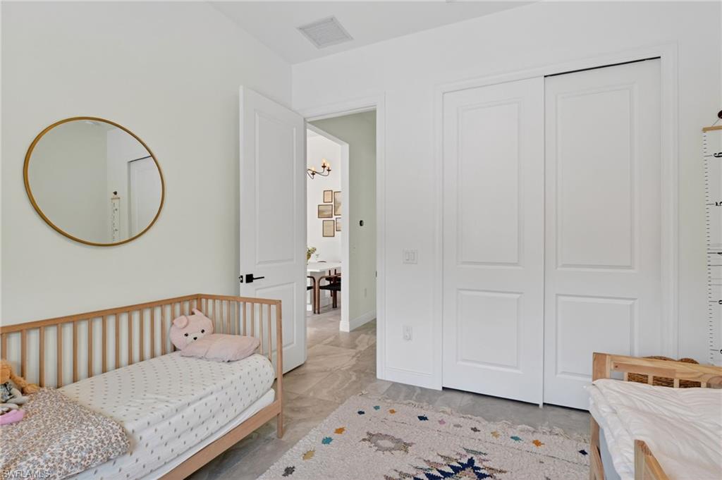 Bright room with light-colored walls and large format tile flooring