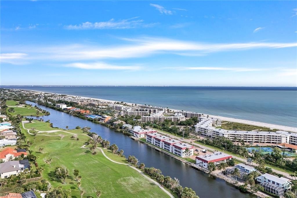 Coastal community featuring direct beach access, a canal waterway, and golf course frontage