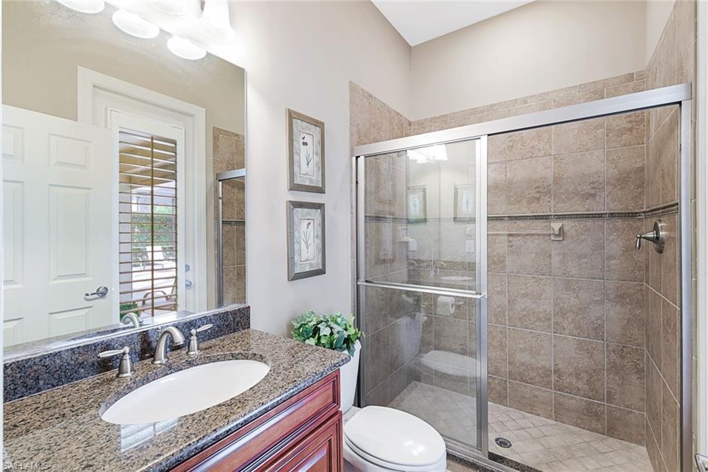 Pool Bath with entrance to Pool & screened Lanai