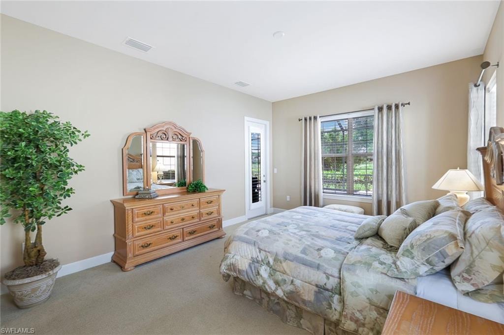 Master bedroom with an outdoor entrance to screened Lanai and Pool