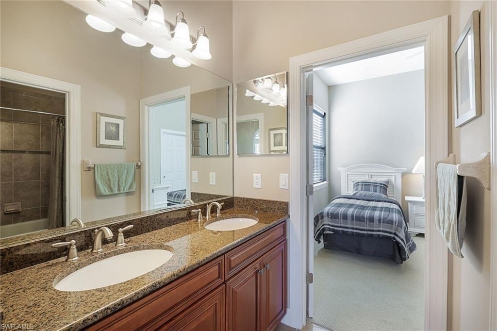 Jack & Jill Bathroom with double sinks with tub & shower