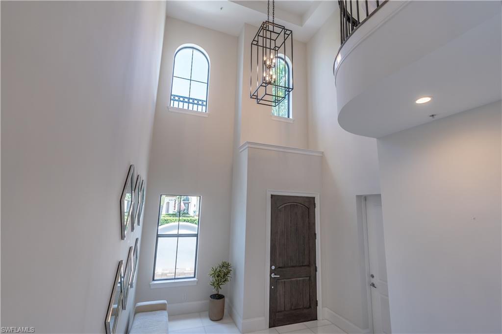 Foyer with grand marble staircase and elevator