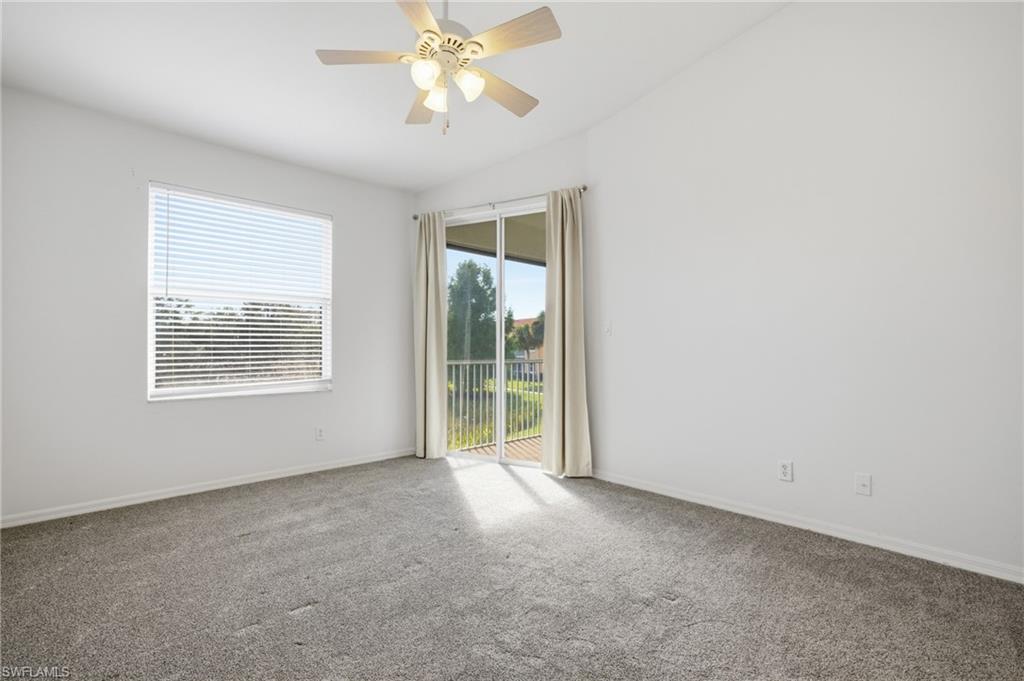 Newer carpet, lighted ceiling fan, and vaulted ceiling
