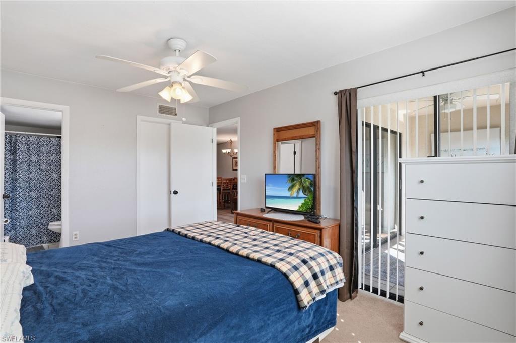 Primary Bedroom with neutral wall paint and light-colored carpet flooring - Virtually Edited Image