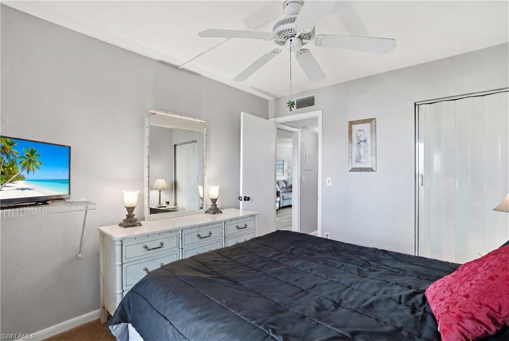 Recessed ceiling fan with light fixture, accordion closet doors, and light gray wall paint - Virtually Edited Image