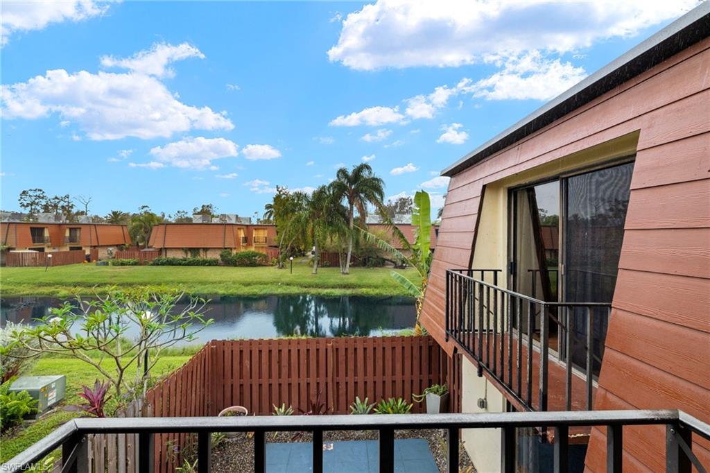 Balcony overlooking a tranquil waterway and lush landscaping