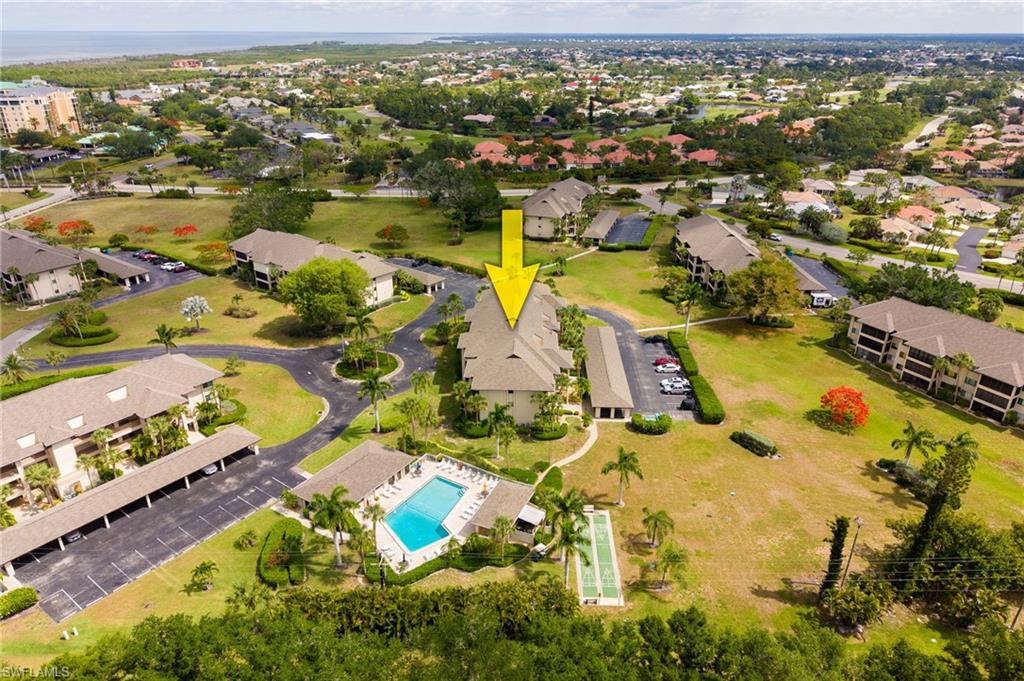 Multi-unit property situated within a complex featuring mature landscaping