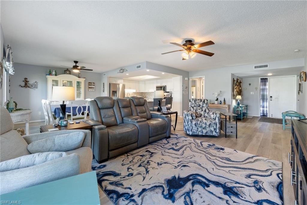 Open-concept living area featuring light wood-finish flooring throughout