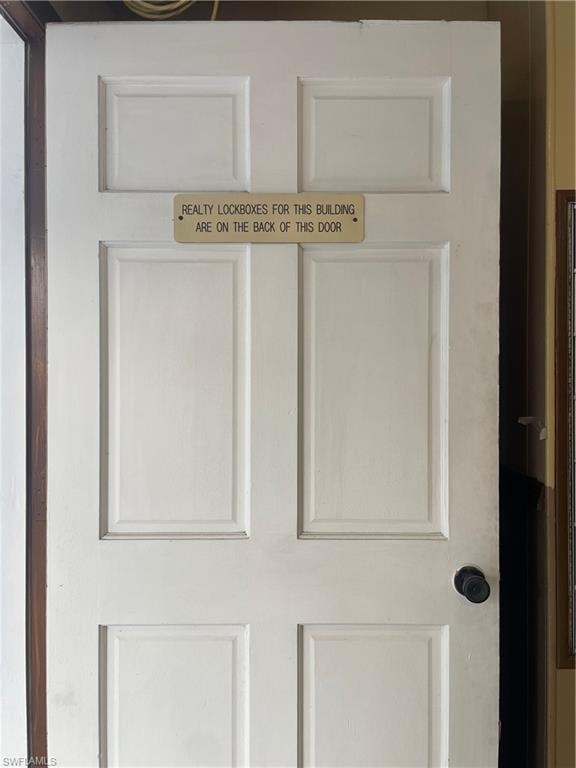 This wood door is before the entrance glass door
