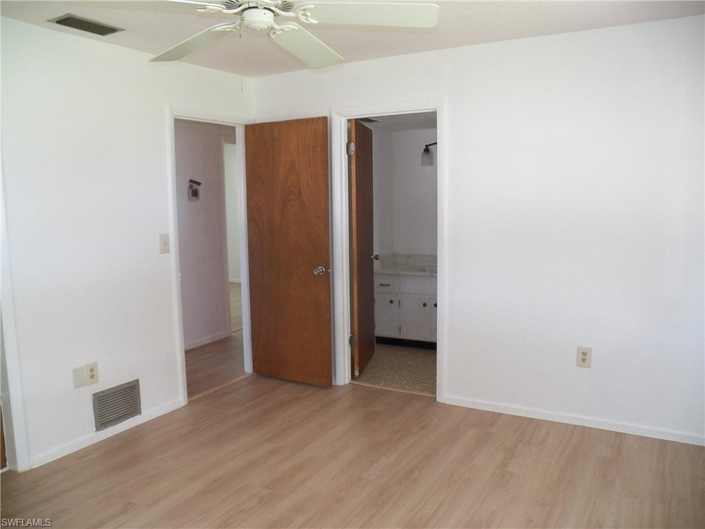 Primary bath door from the primary bedroom