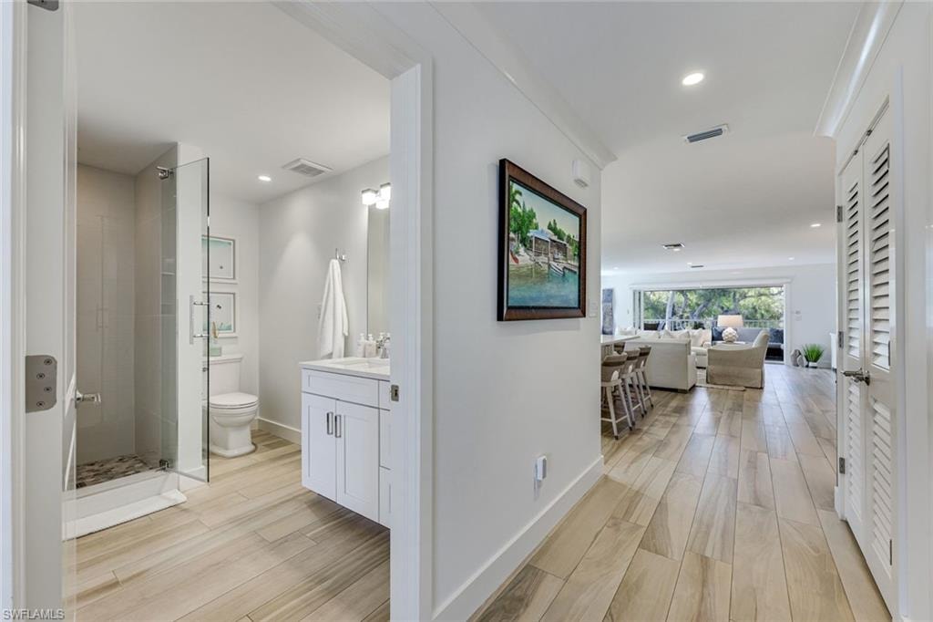 Den ensuite bathroom/powder room as you enter the home.