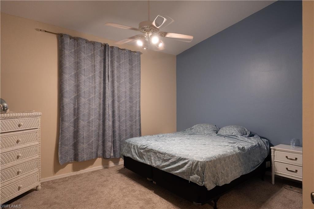 Bedroom with carpet and ceiling fan