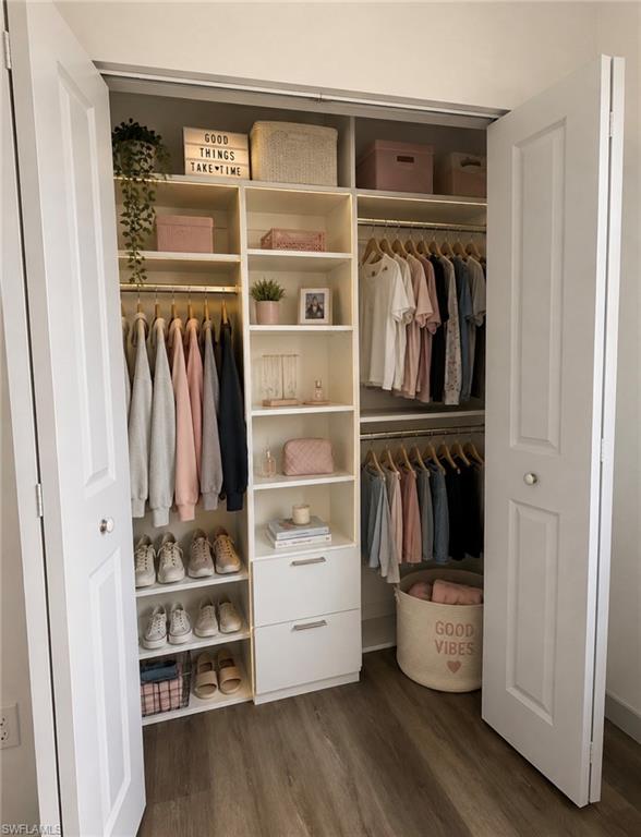 Custom closet system featuring built-in shelving, hanging rods, and integrated drawers