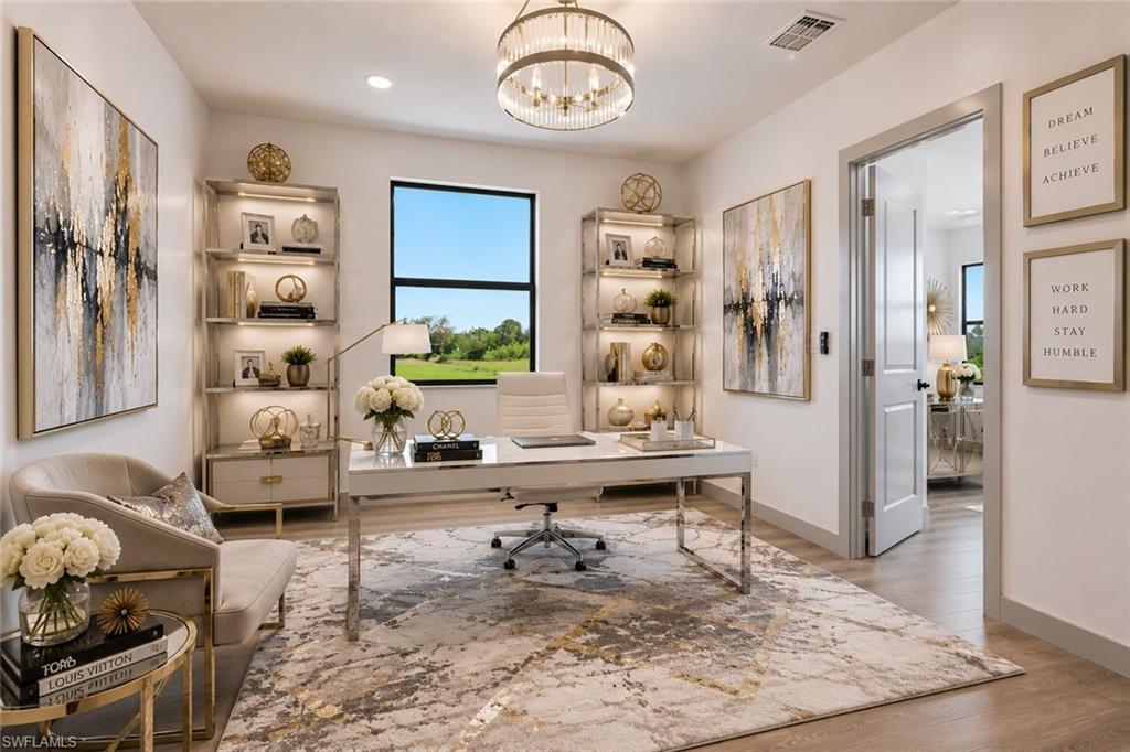Spacious room featuring wood-finish flooring, a large window, a chandelier, recessed lighting, and built-in shelving with integrated lighting