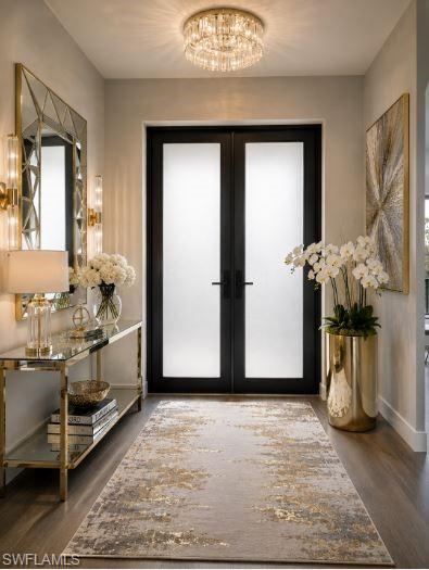 Entryway featuring double doors with frosted glass panels, wood-finish flooring, and a crystal flush-mount ceiling fixture