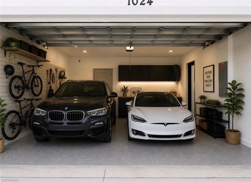 Two-car garage featuring a speckled epoxy floor and side door Virtually Staged