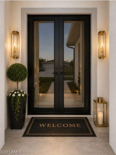 Double-door entry with black frames and full-light glass panels