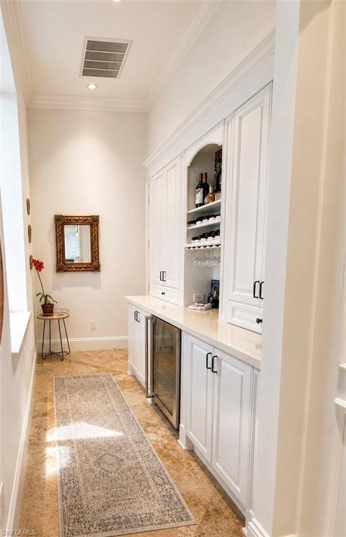 Bar and storage next to kitchen