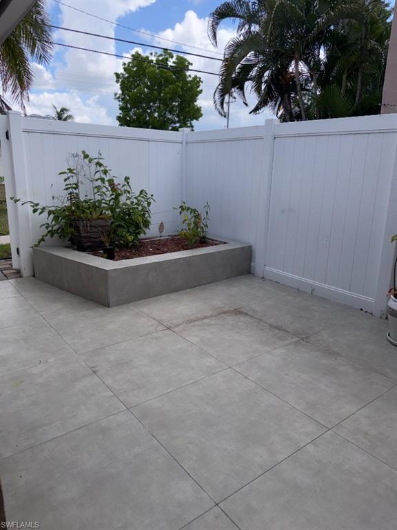 Private outdoor patio area featuring large format grey pavers