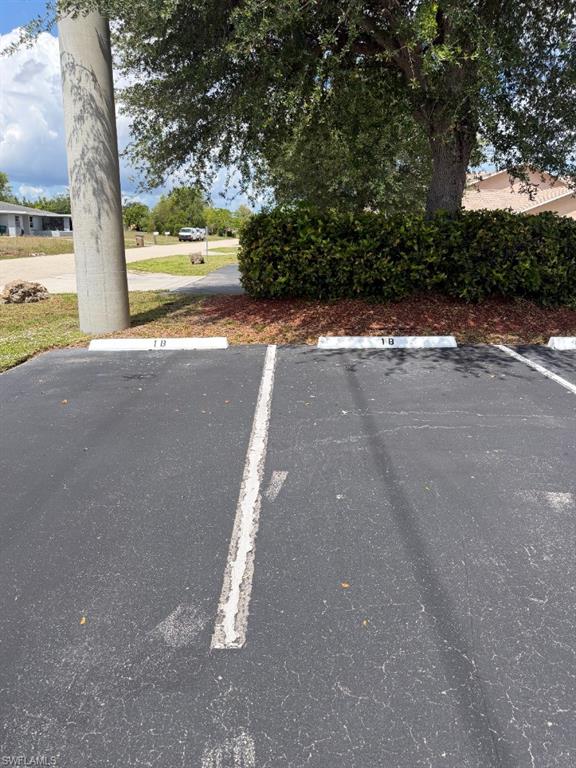Paved parking area featuring designated spaces with numbered parking blocks